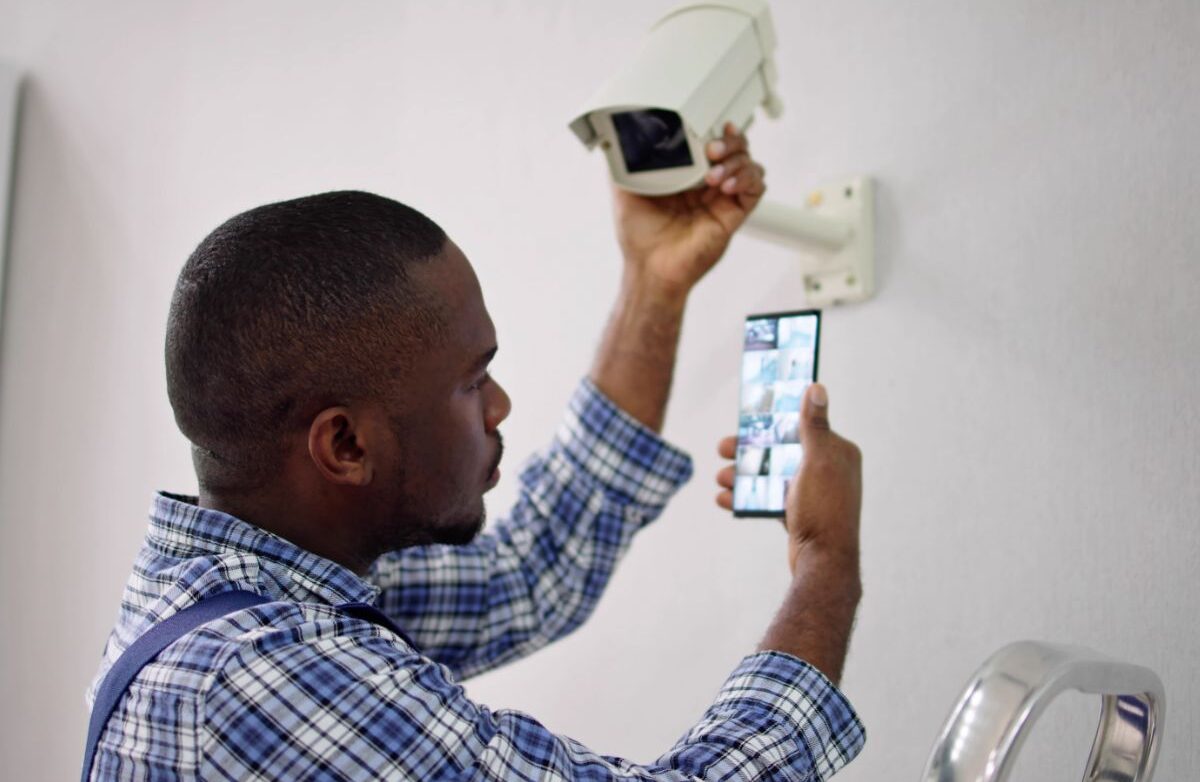 Man looking at CCTV cameras from his phone